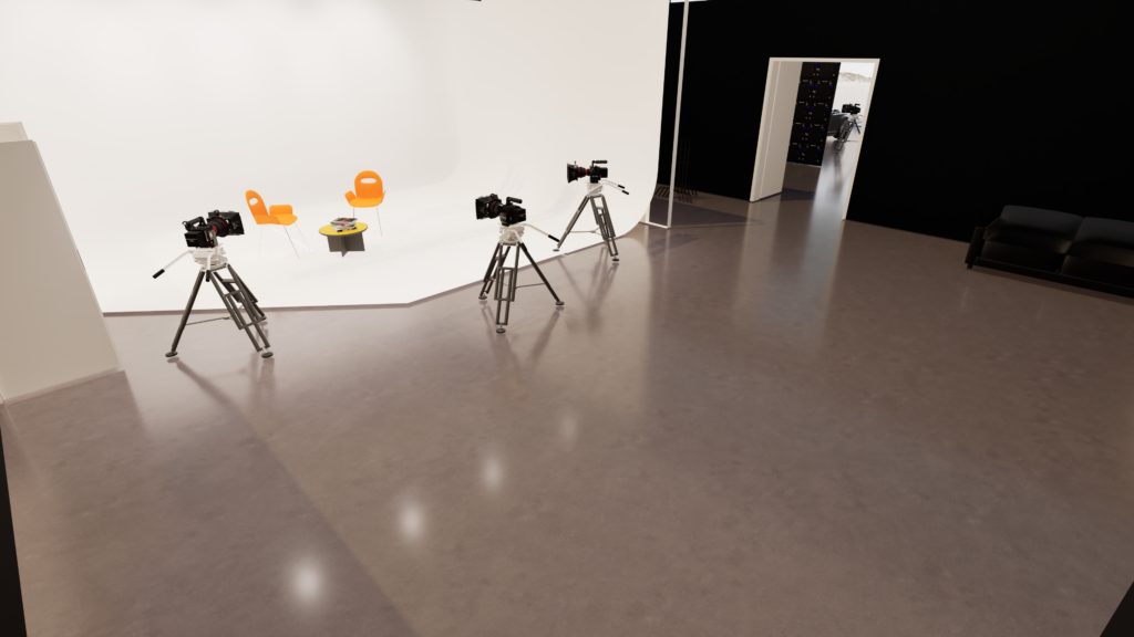 The Hybrid Stage — Our largest room: an 8×7m cyclorama under a motorised truss ceiling, built to flex from a bright white-box to a full black-box inside the same studio day.